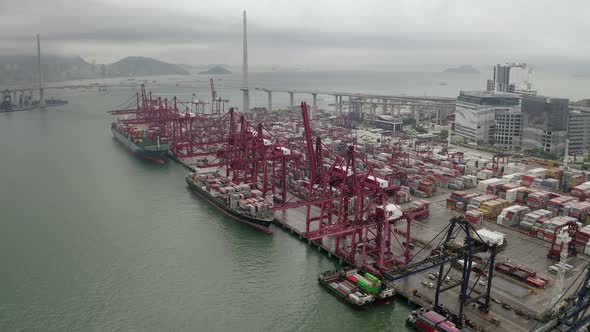 Drone Aerial view 4k Footage of Shipping to harbor by crane in Victoria Harbour