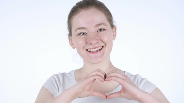 Heart Sign By Redhead Woman White Background