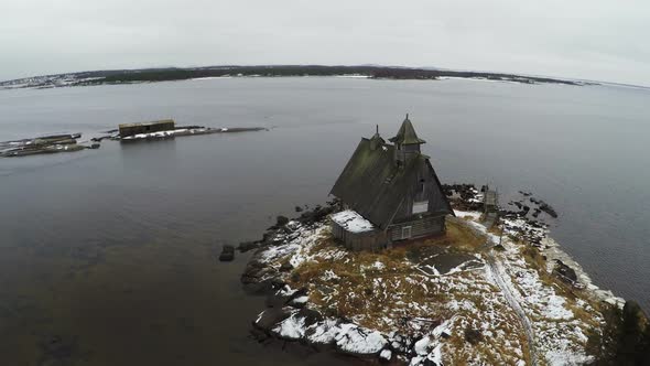 Aerial view of old house on winter coast