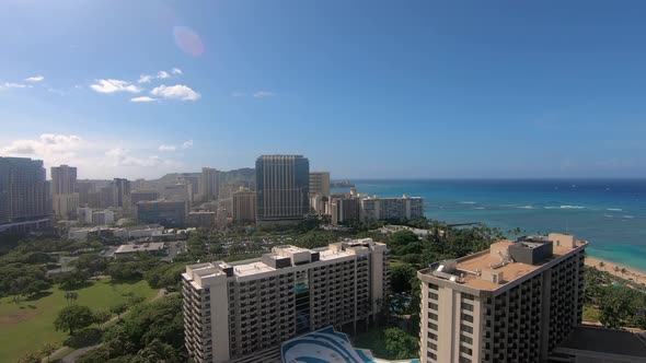 Luxury buildings and turquoise sea with sandy beach in Hawaii