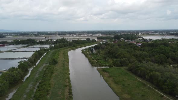 Aerial fly over green scenery fish farm