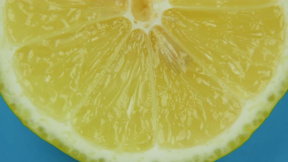 Close Up Slice of Lemon Swirls on a Blue Background