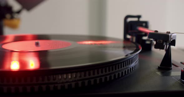 Hand Turns on a Vintage Vinyl Record and Vinyl Record is Spinning