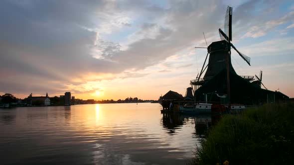 Windmills at Zaanse Schans in Holland on Sunset. Zaandam, Nether