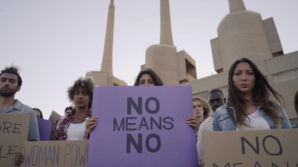 Multiethnic Activist Holding Banners Supporting Woman's Rights