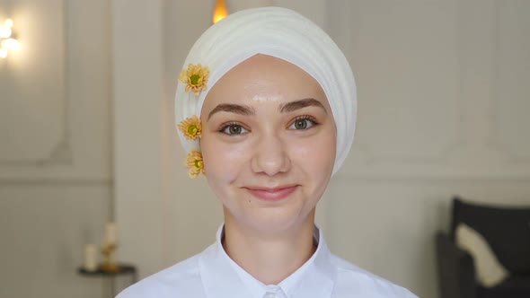 Portrait of Young Smiling Muslim Confident Woman or Teenage Girl in Dental Braces on White Teeth