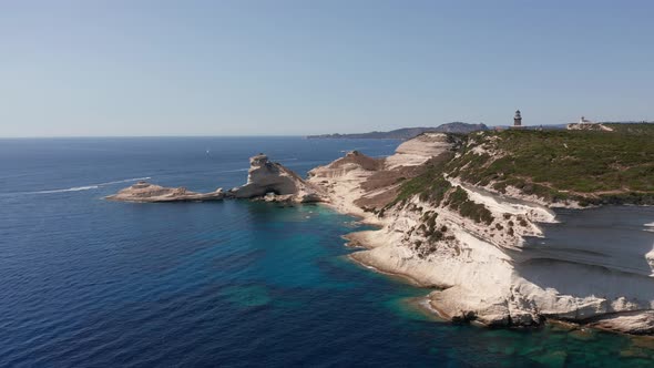 Aerial View of White Bluff Beach on Bay on the Coastline with Waves in the Blue Sea