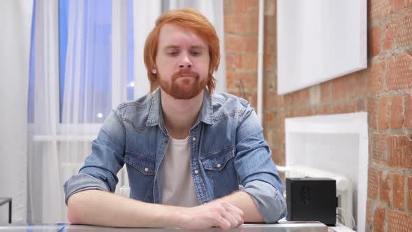 Sad Redhead Beard Man Feeling Upset and Thinking About Problems