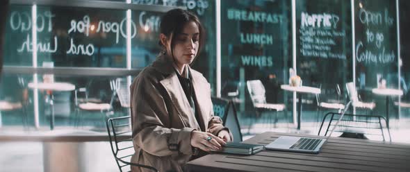 Professional woman sitting down prepare workstation on laptop