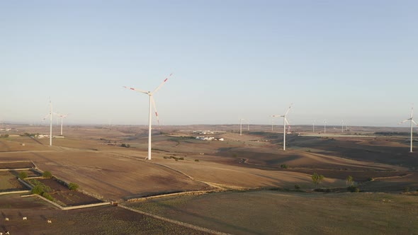 Wind turbine farm on beautiful morning landscape