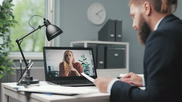 Man Having Videochat at Office