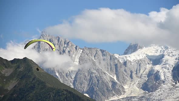 Paraglider Flying with Scenic Mountains Vista