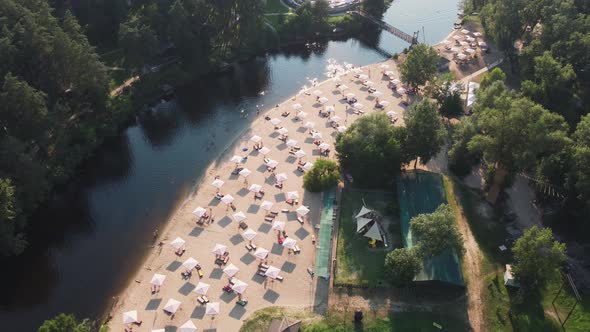 Aerial Top View of River Sand Beach with Lounges and Umbrellas