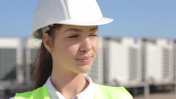 Portrait of a Happy Woman Engineer is Looking at the Camera