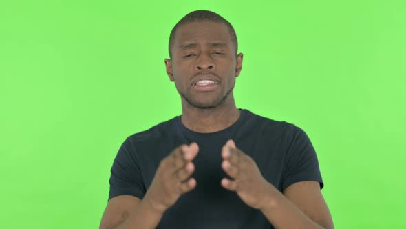 Video Chat By Young African Man on Green Background