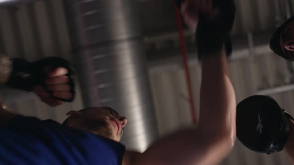 Low angle of a bodybuilder doing boxing training