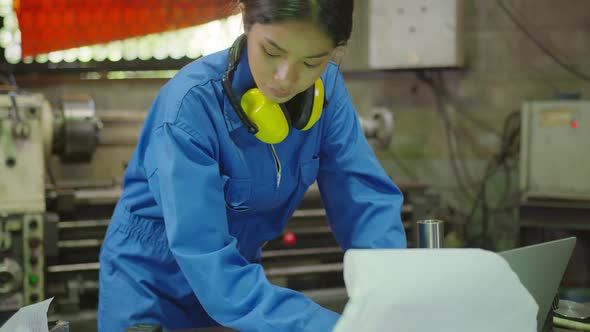 Asian female Professional engineering wearing uniform and safety goggles