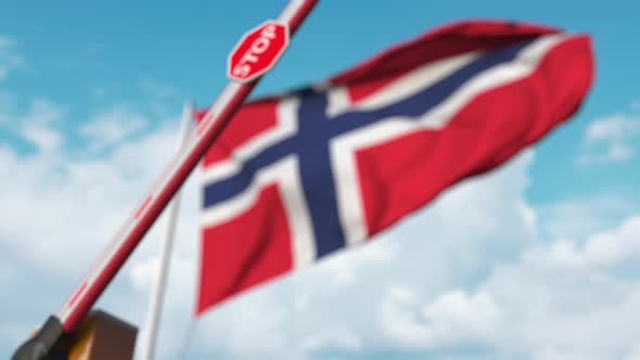 Barrier Gate Being Closed with Flag of Norway As a Background