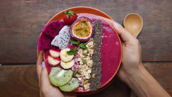 Hands Holding Vegan Smoothie Bowl With Fruits And Superfoods