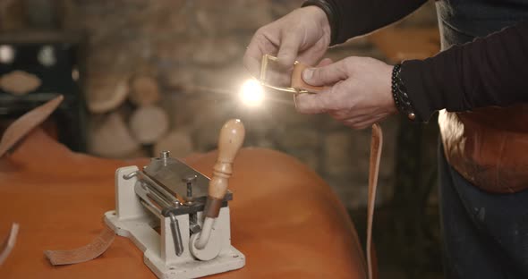 Craftsman Working with Leather in a Workshop