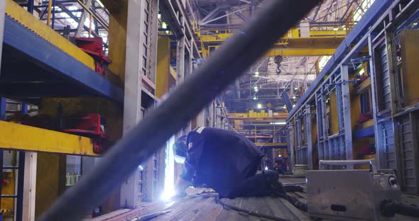 A Welder Is Working at the Plant