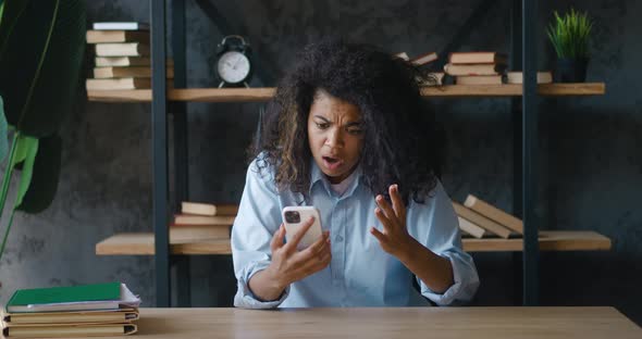 Shocked African American Business Woman Upset with Bad Deal Looking at Laptop Screen Reaction on
