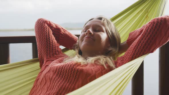 Caucasian woman having a good time on a trip to the mountains, smiling