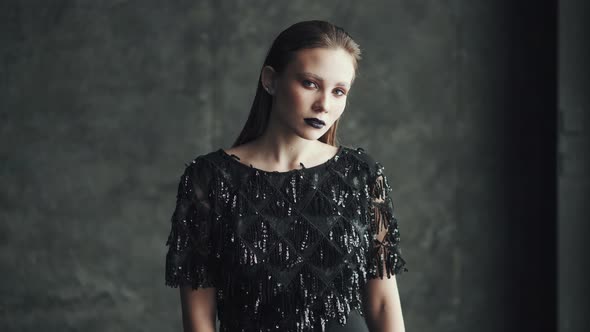 Portrait of a Bright Attractive Girl with Blue Lips and Bright Makeup. Young Woman with Unusual