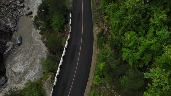 Top view of the river and asphalt road.