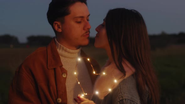 Couple kisses at night for valentine's day