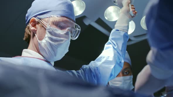 Male Surgeon Working in Operating Room