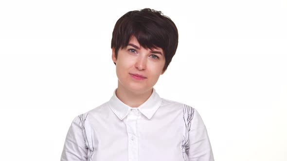 Goodlooking Lady with Short Haircut Looking at Camera and Smiling Isolated Over White Backgrouund