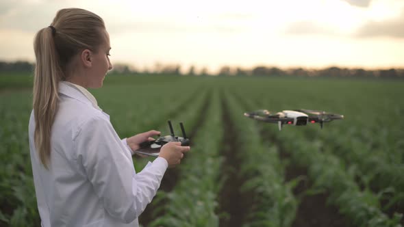 Woman Agronomist Controls Drone