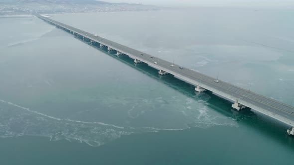 Aerial Drone View of Lowwater Bridge Across the Bay with Moving Car