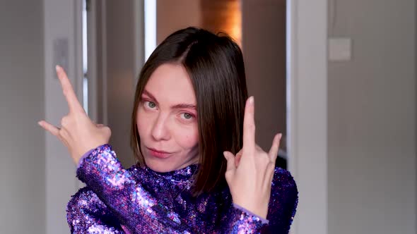 Attractive Woman Short Hairstyle Shows Gesture Horns