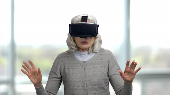Old Lady Shocked Experiencing Virtual Reality Headset