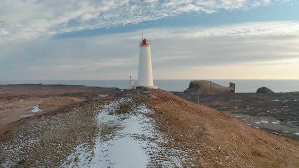 Aerial View of the Lighthouse at Reykjanes Peninsula During Sunset. Iceland in Early Spring