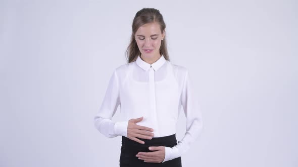Young Happy Pregnant Businesswoman with Arms Crossed