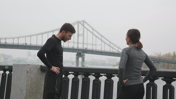 Young Motivated Happy Running Couple in Sportswear Finished Hard Training and Resting After Workouts