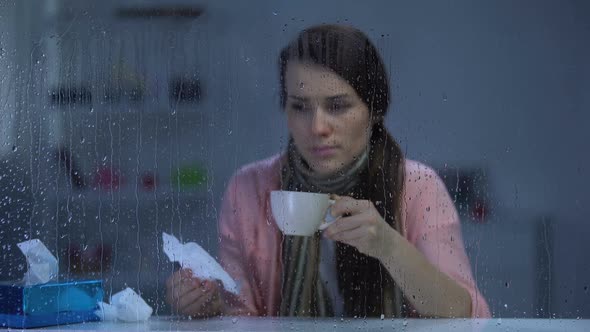 Sick Woman Sneezing and Drinking Hot Tea in Rainy Weather, Flu Virus Epidemic