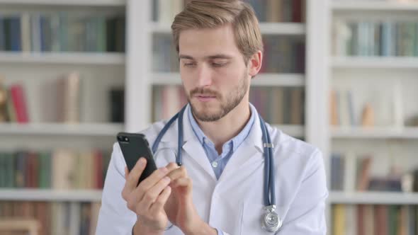Portrait of Doctor Using Smartphone