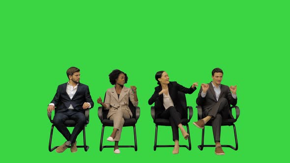 Young Office Workers Having Fun on a Break Shaking to Some Music on a Green Screen Chroma Key