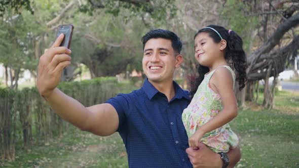 Father and Daughter Taking Selfie