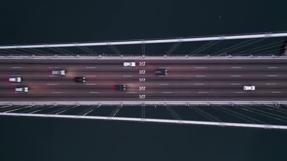  Aerial Top Down Shot of Vehicles Driving By Bay Bridge Towards San Francisco