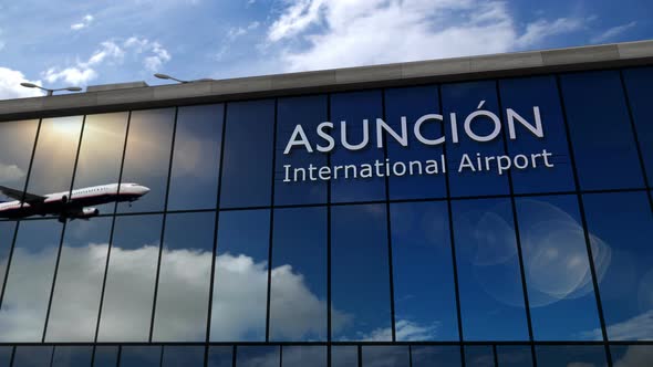 Airplane landing at Asuncion Paraguay, Asunción airport mirrored in terminal