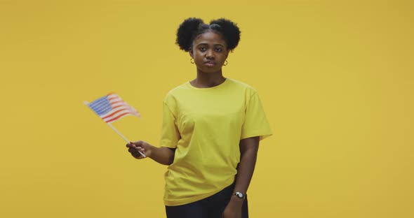 Woman Waving US Flag