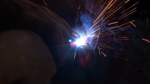 Worker Welds Balloon Nozzle