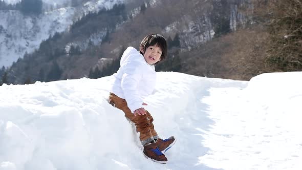 Cute Asian Child Playing Snow Outdoors Slow Motion