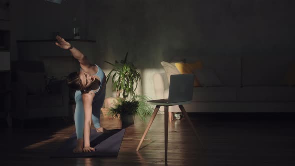 Fit Woman Doing Yoga At Home