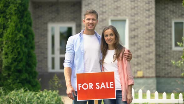 Happy Couple Standing Near for Sale Signboard, Family Moving to Another Place